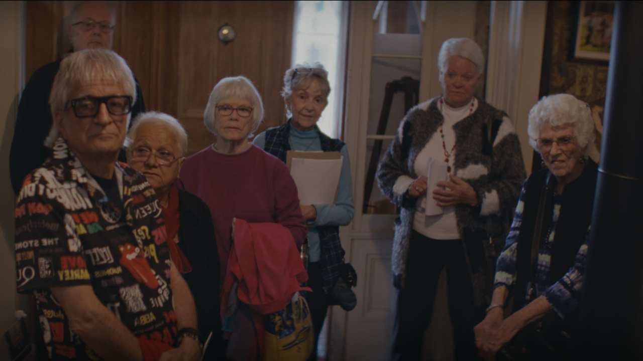 a group of men and woman standing together